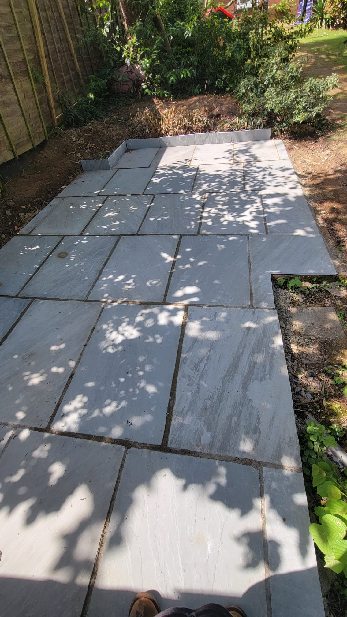 Finished natural stone pathway after paving works